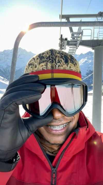 The Wonderkid face ski mask, goggles down on the chairlift